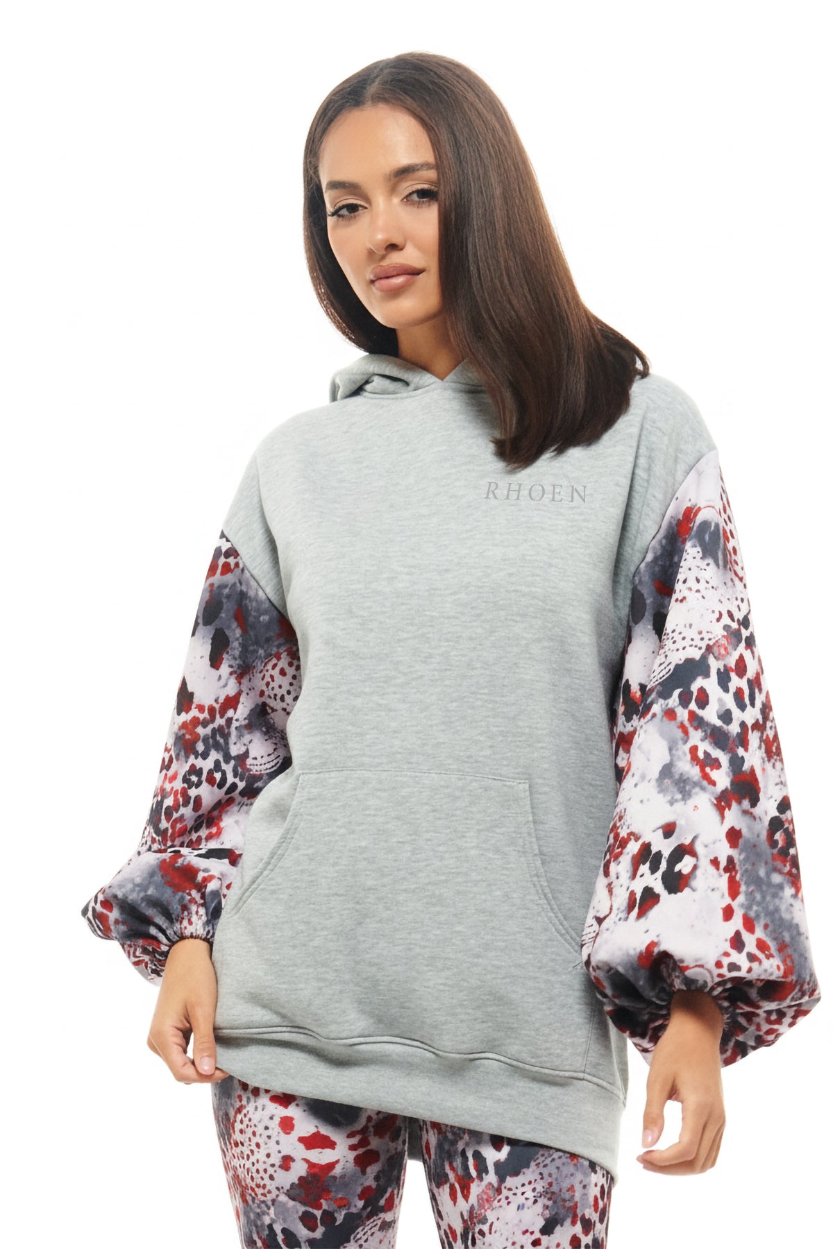Designer oversized hoodie by RHOEN featuring printed statement sleeves in Rebecca Rhoades signature leopard-inspired pattern.