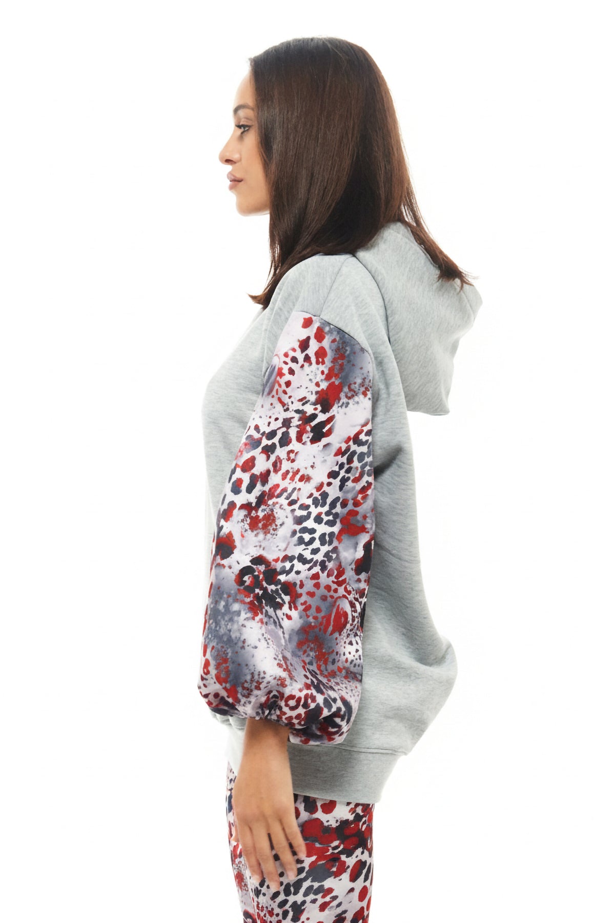 RHOEN women’s fashion hoodie in soft grey jersey with contrasting patterned sleeves in red, black, and grey abstract print.