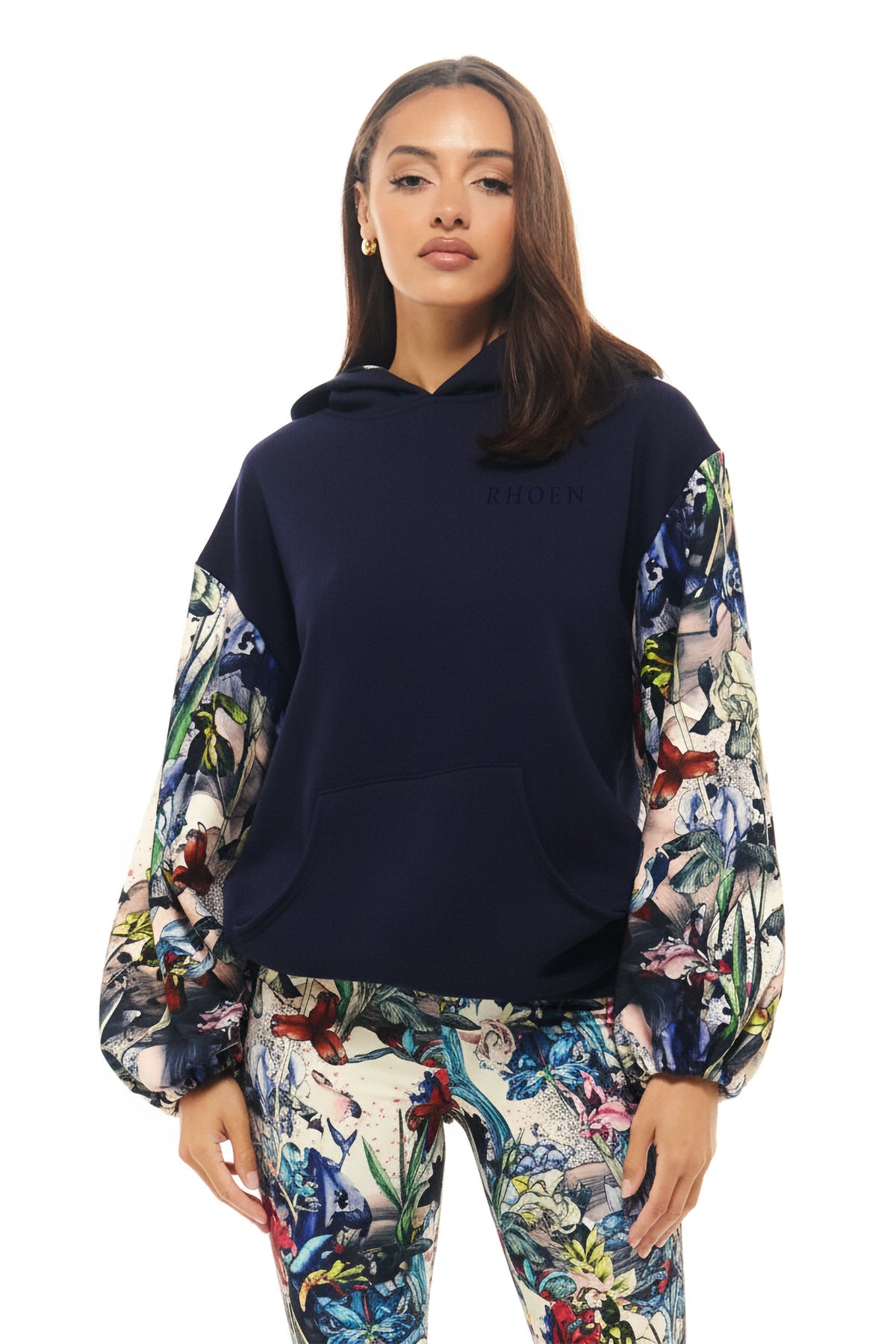 Navy RHOEN hoodie with exclusive Rebecca Rhoades botanical print balloon sleeves and kangaroo pocket.