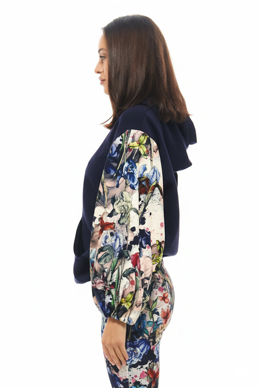 Designer oversized hoodie in navy by RHOEN, featuring statement sleeves in bespoke floral fantasy print by Rebecca Rhoades.