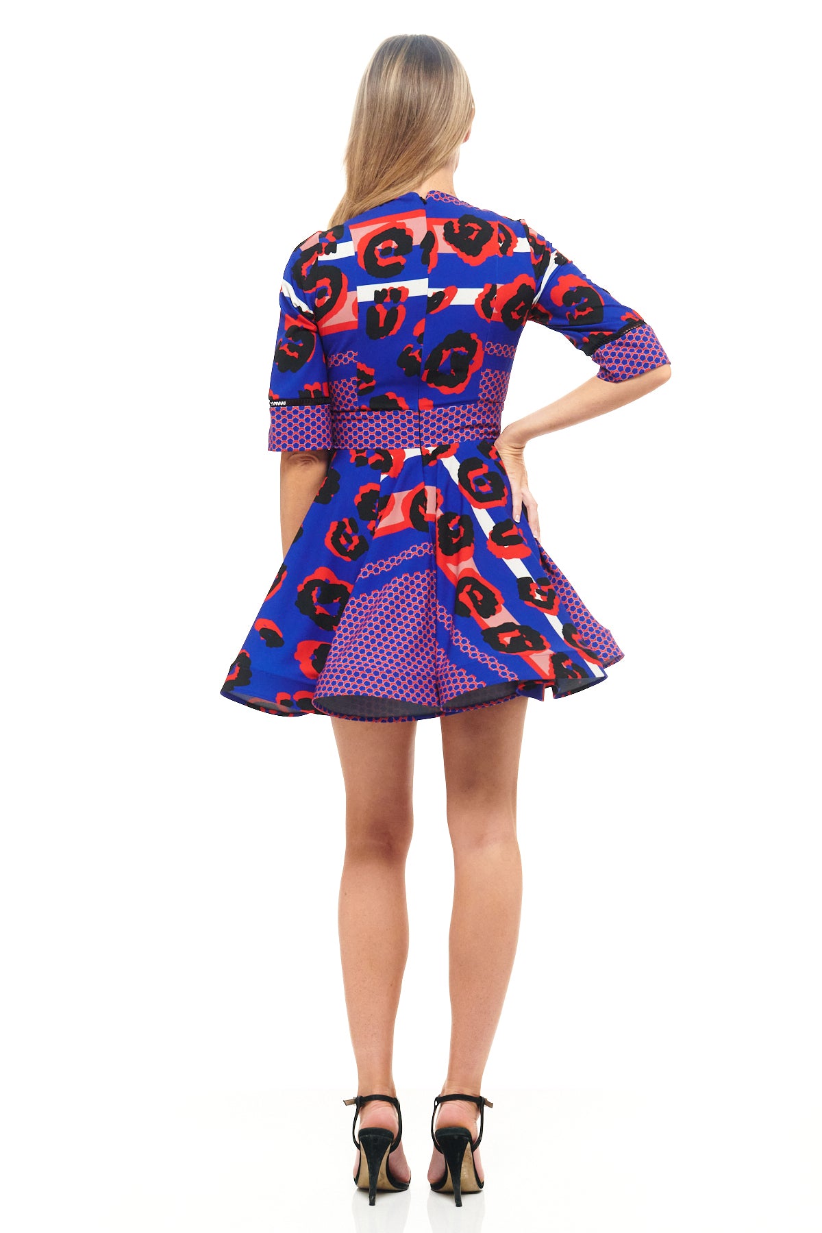 RHOEN bespoke animal print mini dress – statement short dress with high neck, three-quarter sleeves, and voluminous skirt. Exclusive Rebecca Rhoades design.