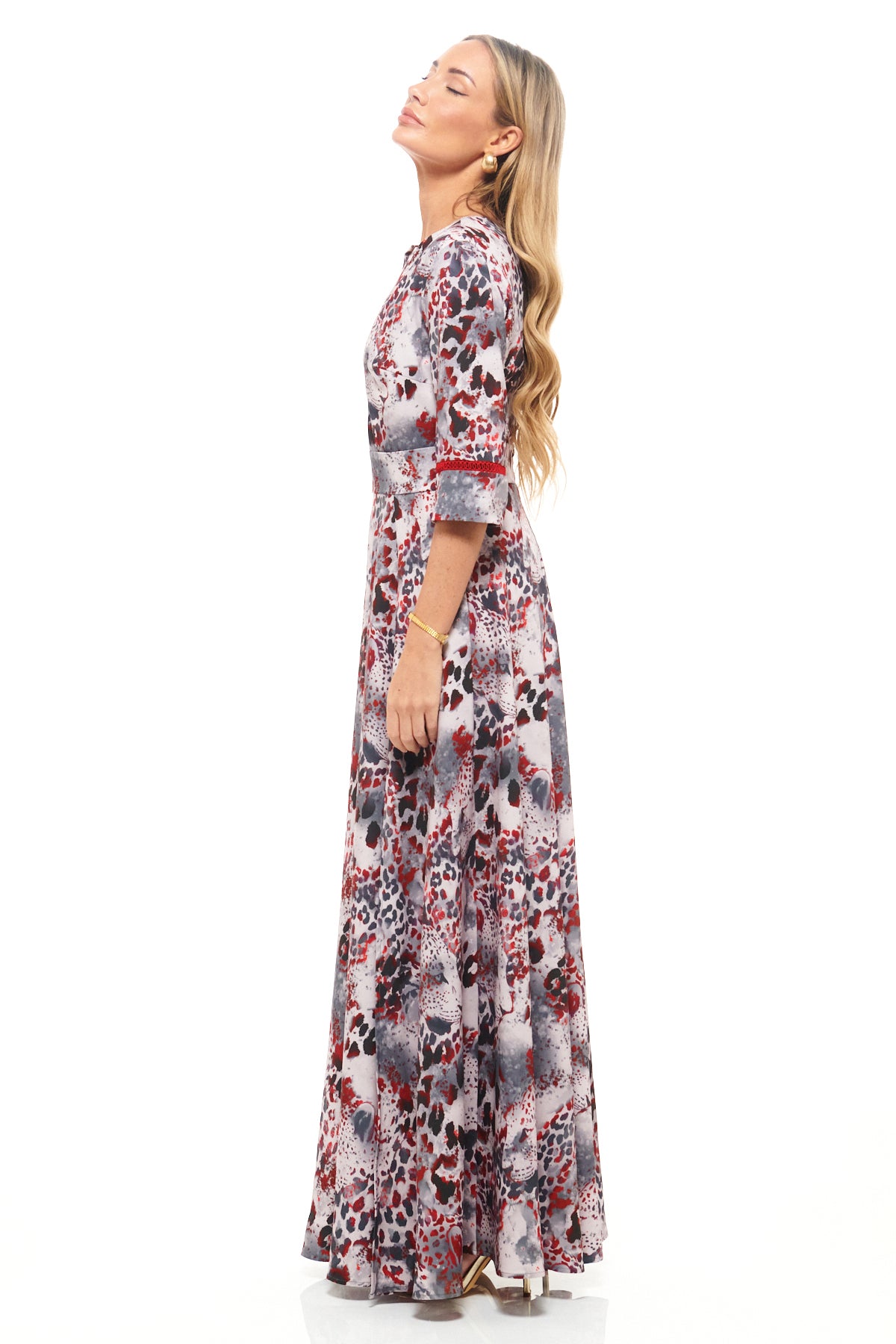 Designer occasion maxi dress by RHOEN (formerly Rebecca Rhoades) – red and grey leopard-inspired print with side split and fitted silhouette.