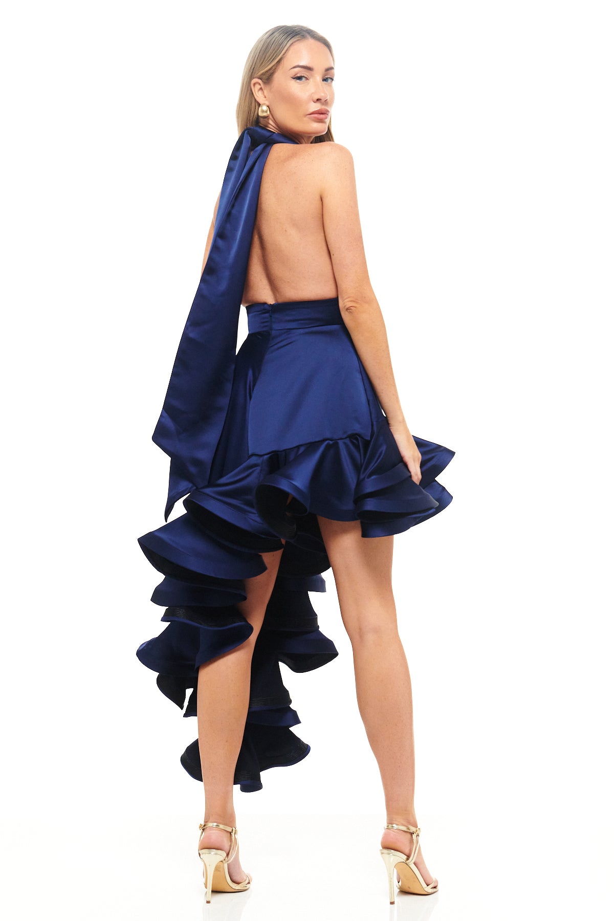 Designer navy satin asymmetric hem dress – RHOEN by Rebecca Rhoades, with sculptural layered ruffles and halter-style neckline.