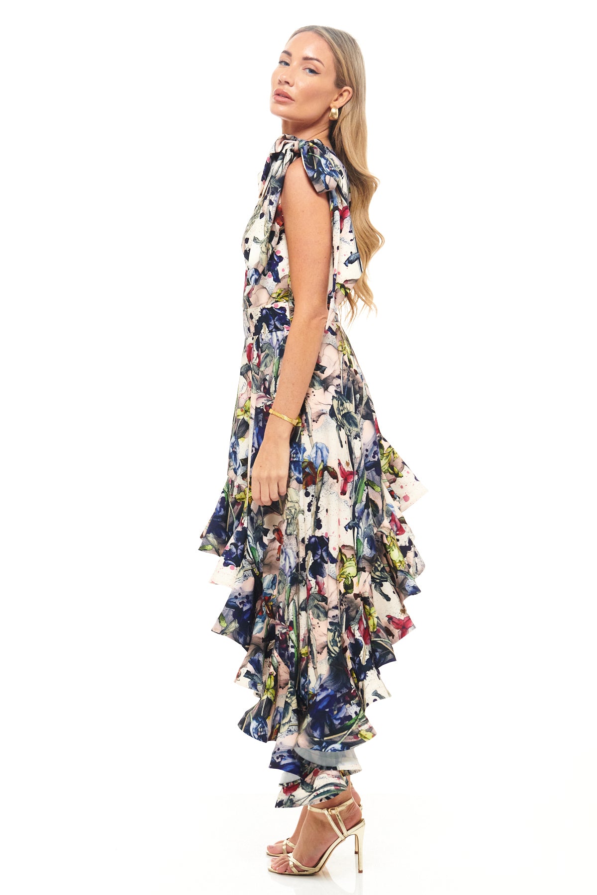 RHOEN bespoke print asymmetric gown – exclusive Rebecca Rhoades design with bold one-shoulder cut and tiered cascading ruffle detail.