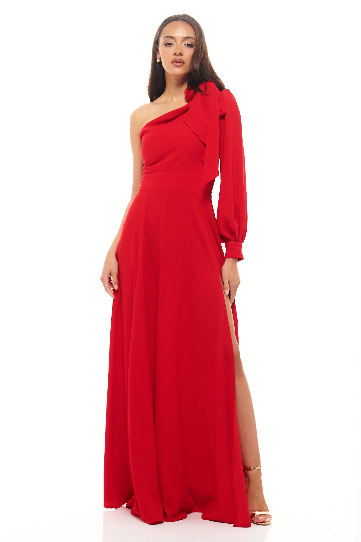 Floor-length Rhoen gown in bold red featuring an asymmetric neckline, single long sleeve with gathered cuff, and flowing skirt with side slit.