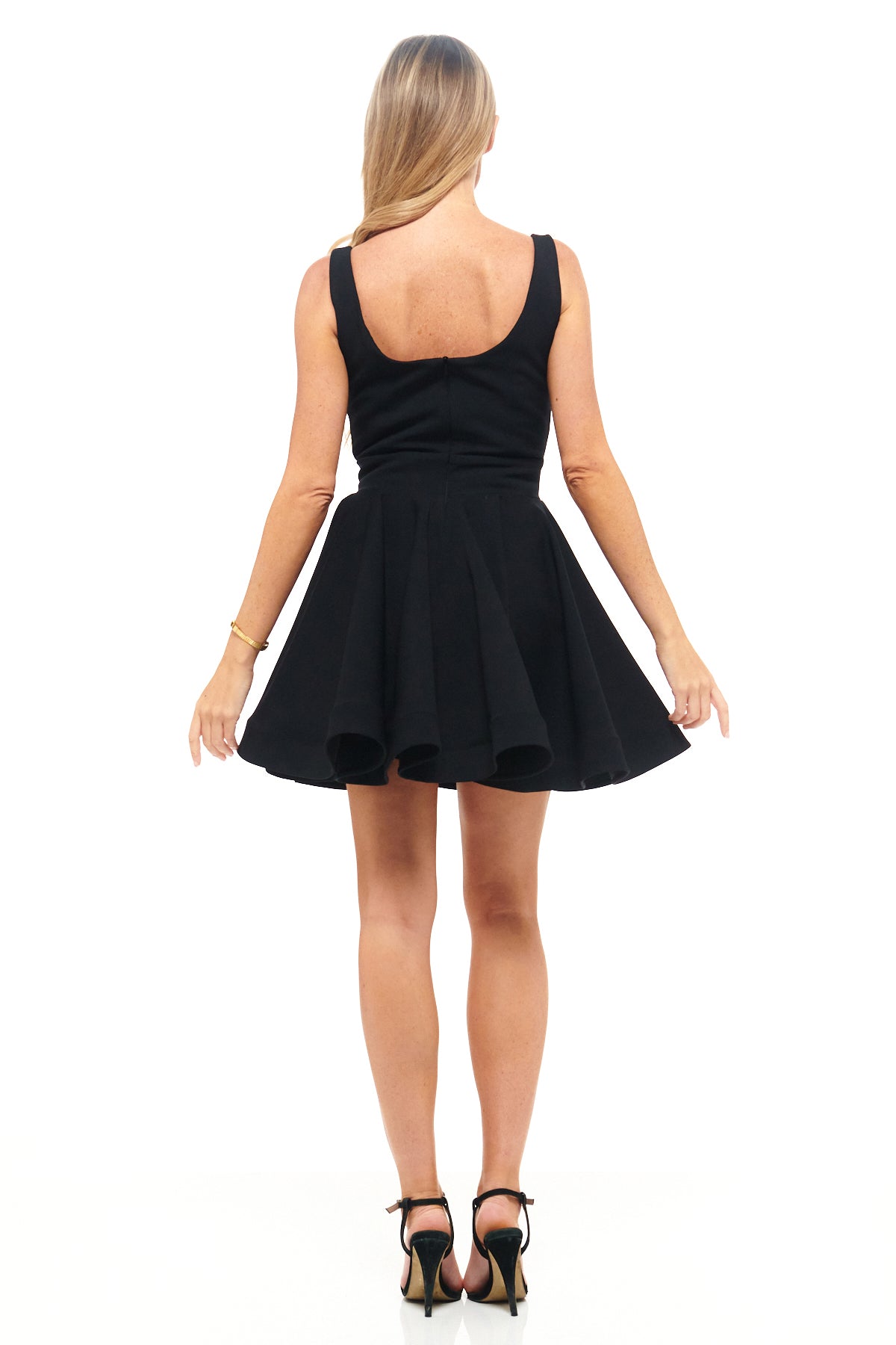 Rebecca Rhoades original design for RHOEN – black skater mini dress with lace-trim neckline and feminine flared silhouette, an elevated LBD for evening style.