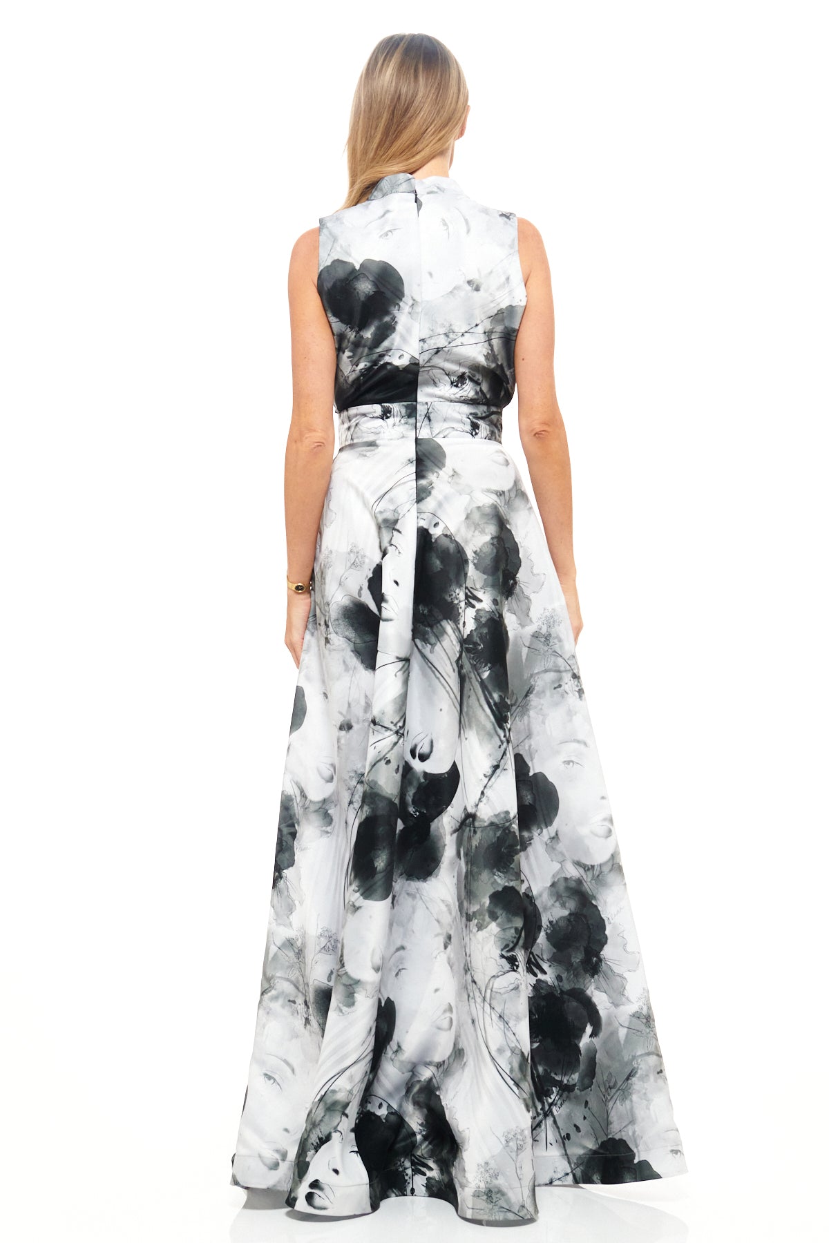 RHOEN designer floor-length dress in monochrome palette, showcasing a tailored V-neck bodice and dramatic illustrated print skirt.