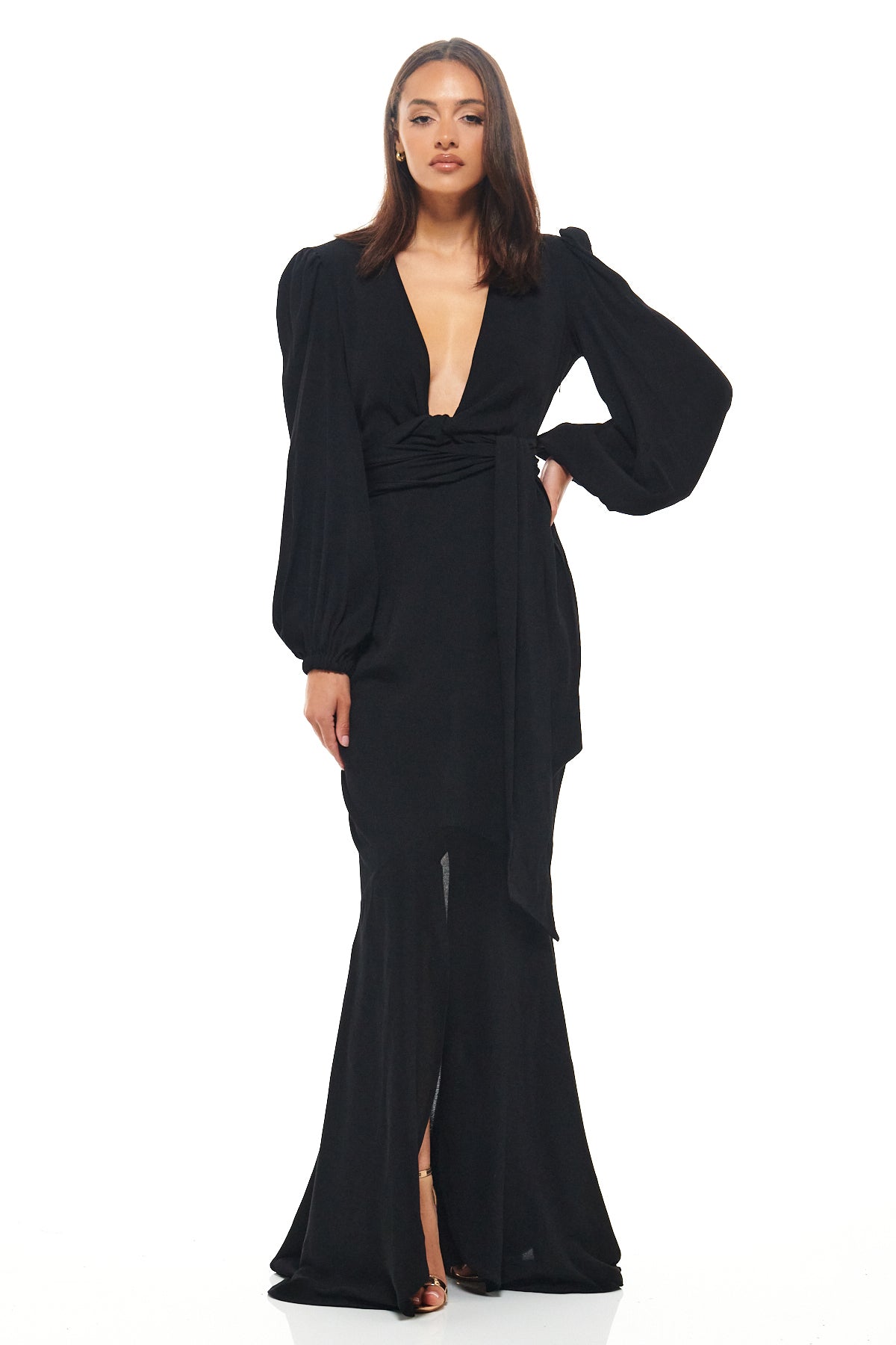 Rhoen black floor-length gown with deep V-neckline, long puff sleeves and a statement tie waist, finished with a fishtail hem for red carpet elegance.