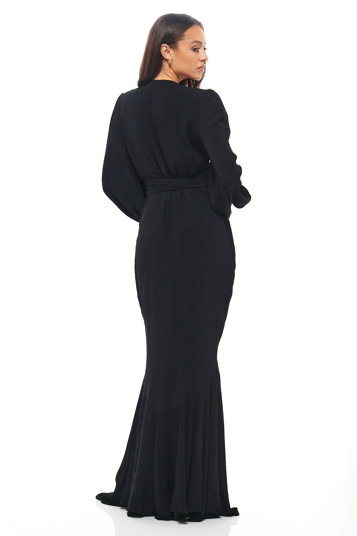 Rhoen’s black fishtail maxi dress with plunging neckline and cinched waist tie, designed for elevated eveningwear and special occasions.