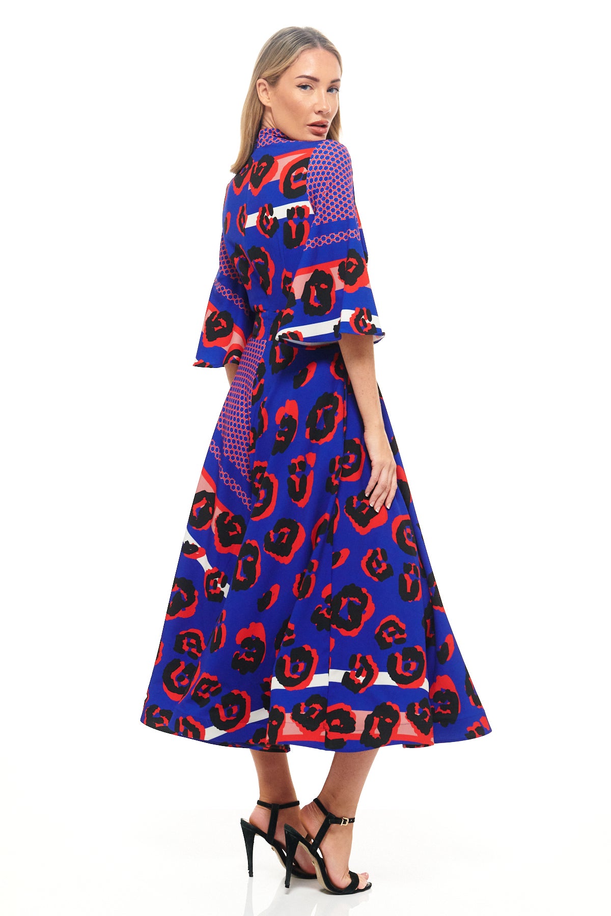 Bold blue leopard print dress by RHOEN (formerly Rebecca Rhoades) – midi length with flared sleeves and A-line silhouette, perfect for luxury occasionwear.