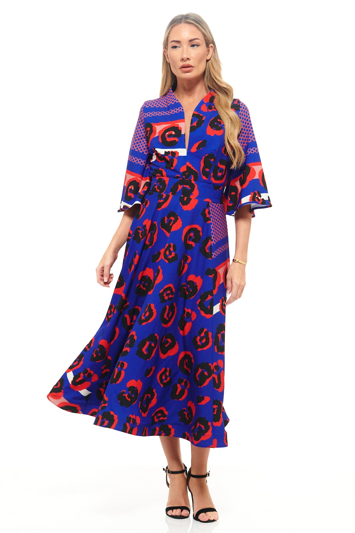 RHOEN bespoke animal print midi dress – exclusive blue and red leopard pattern with V-neckline, fitted bodice, and full flowing skirt.
