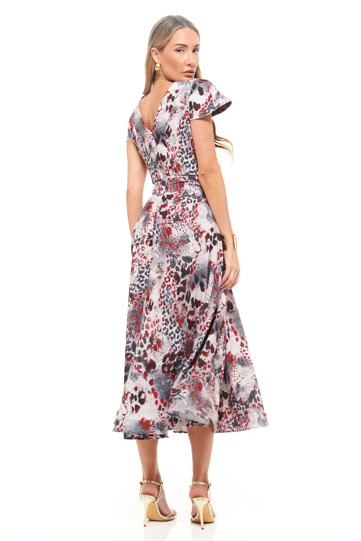 RHOEN bespoke print midi dress – luxury cocktail dress with unique red and grey leopard-inspired pattern, fitted waistline, and feminine silhouette.