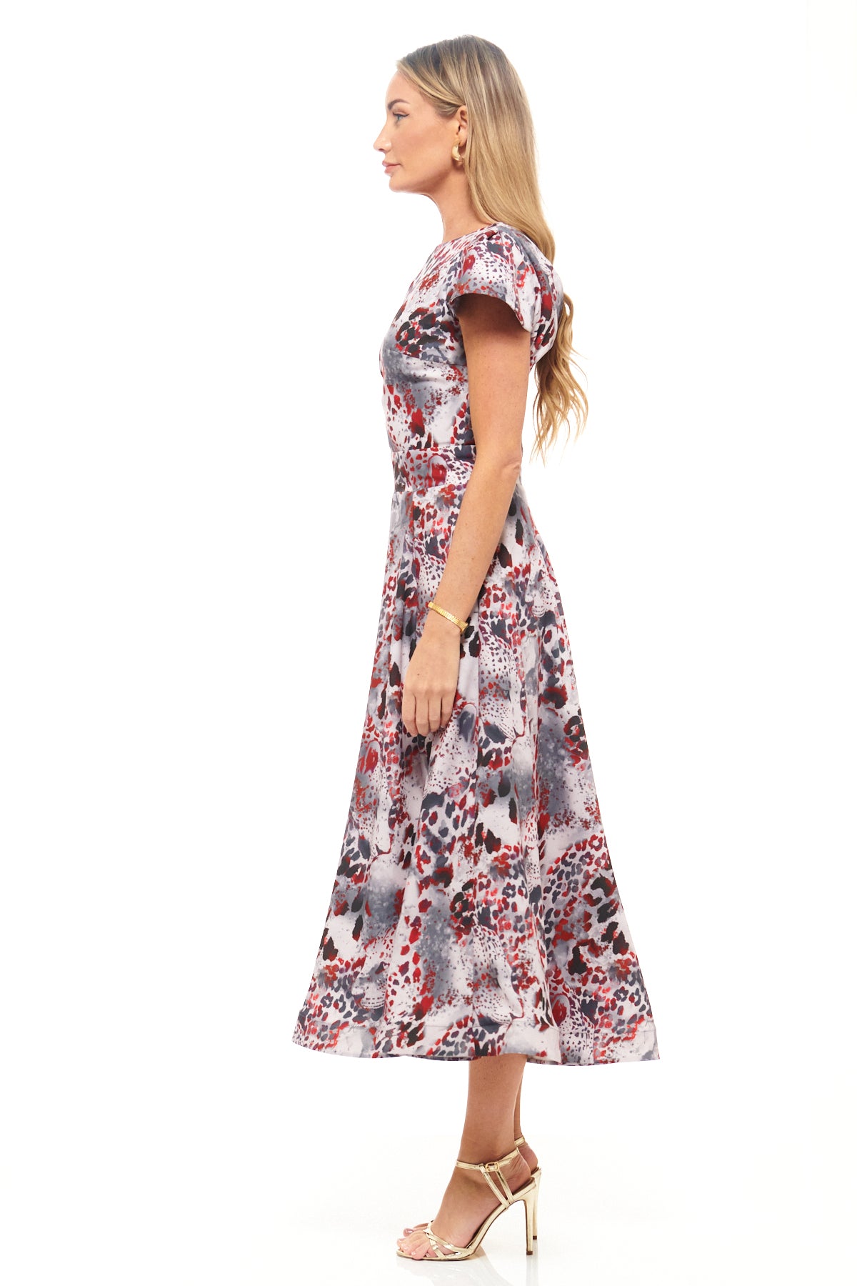 RHOEN animal print occasion dress (formerly Rebecca Rhoades) – midi length with short sleeves, round neckline, and bold red and grey designer print.