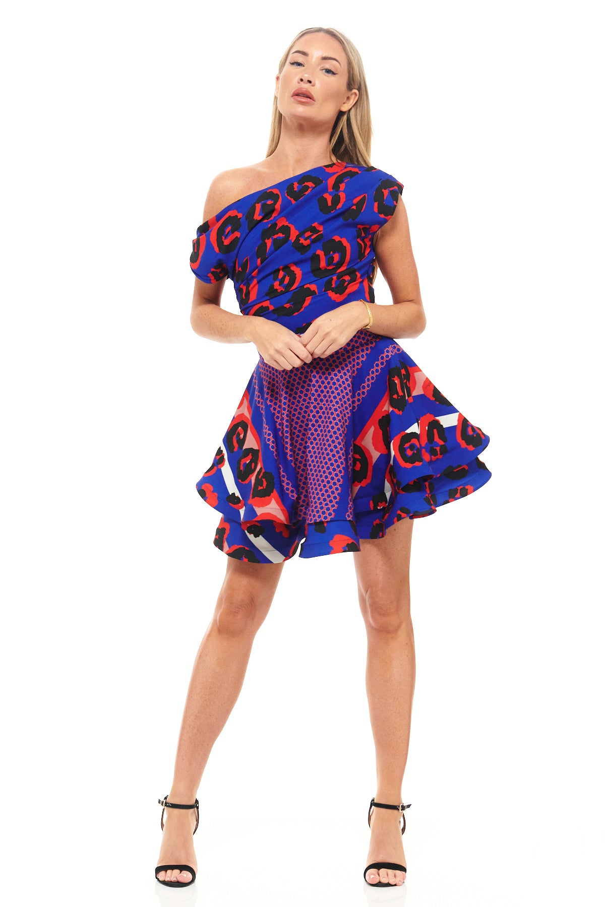 Blue leopard print cocktail dress by RHOEN (formerly Rebecca Rhoades) – asymmetric mini with one-shoulder silhouette and bold pattern.