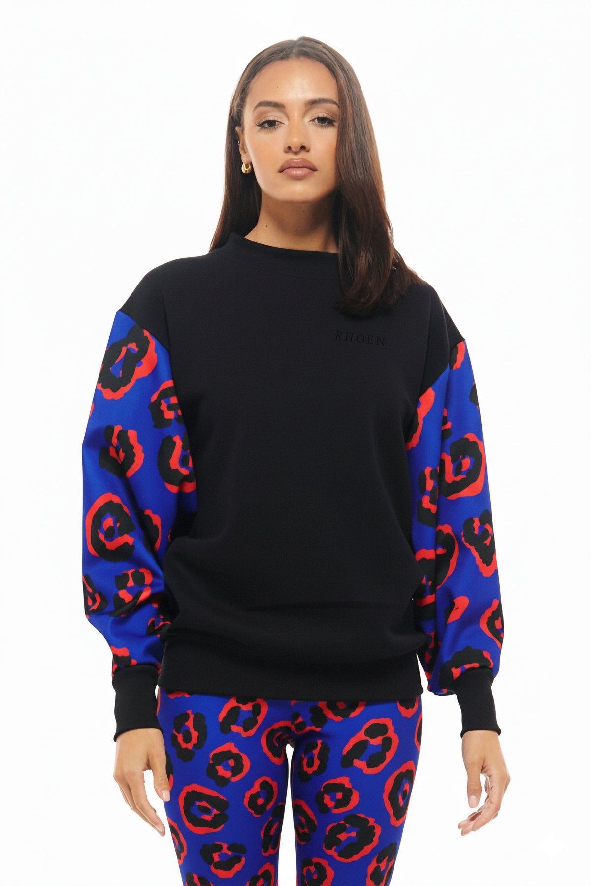 Black RHOEN sweatshirt with vibrant balloon sleeves in the exclusive Blue Leopard print, styled with matching leggings.