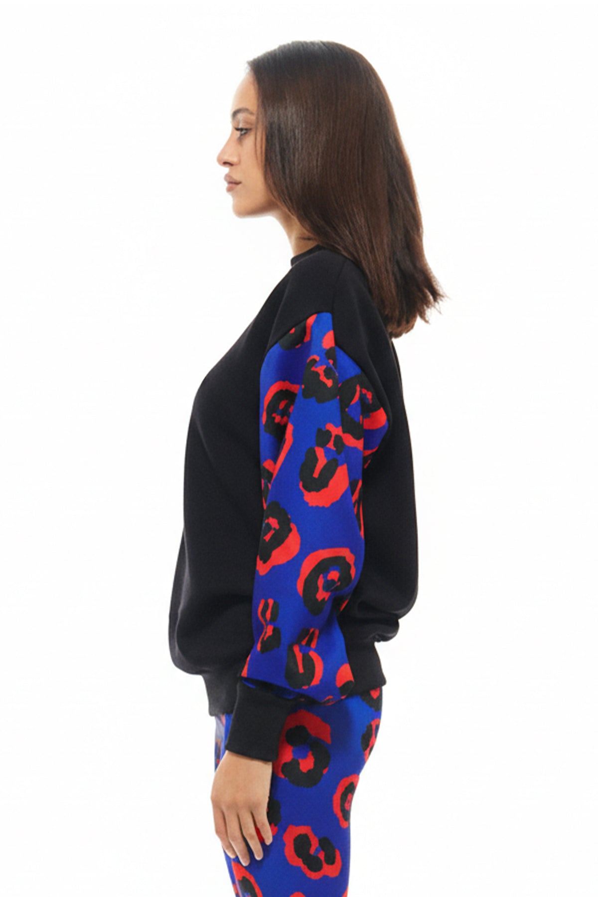 Contemporary sweatshirt with plain black body and contrasting printed sleeves in RHOEN’s bespoke Blue Leopard print.