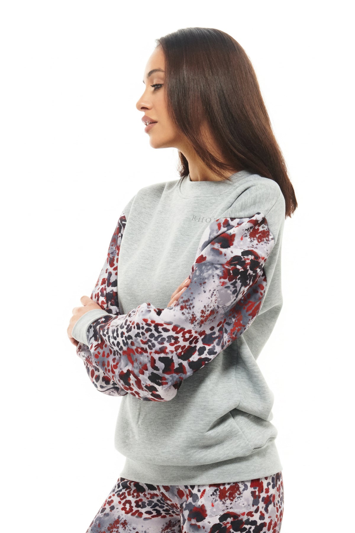 Oversized heather grey crewneck by RHOEN featuring contrast printed sleeves in abstract red, black, and grey leopard design