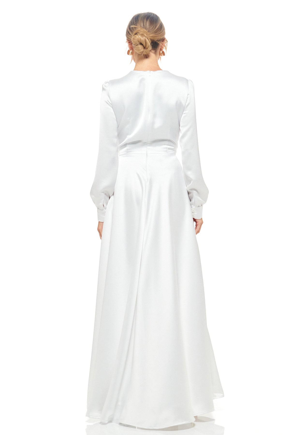 Rhoen contemporary white evening gown, ex-Rebecca Rhoades, featuring silky satin fabric, plunging neckline, and timeless long-sleeve silhouette.