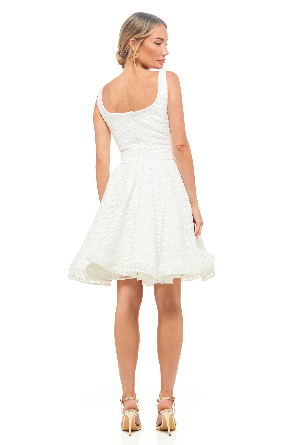 RHOEN ivory scoop neck mini dress with a floral textured overlay, cinched waist, and flared hemline. A chic bridal-inspired look suited for engagement celebrations and after-parties.