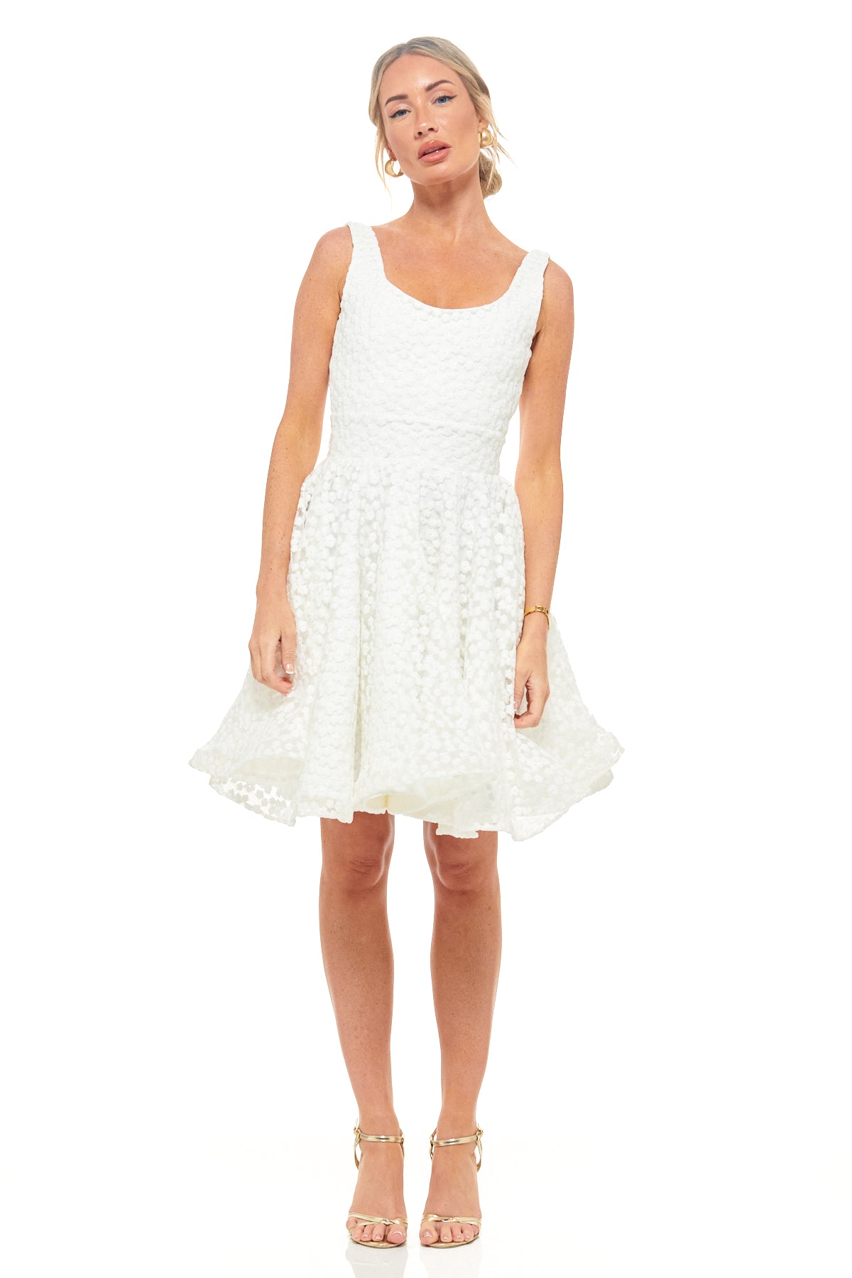 RHOEN ivory textured mini dress with sleeveless scoop neckline, fitted bodice, and flared skirt. A playful yet elegant short bridal dress ideal for wedding receptions, engagement parties, or rehearsal dinners. Formerly Rebecca Rhoades.