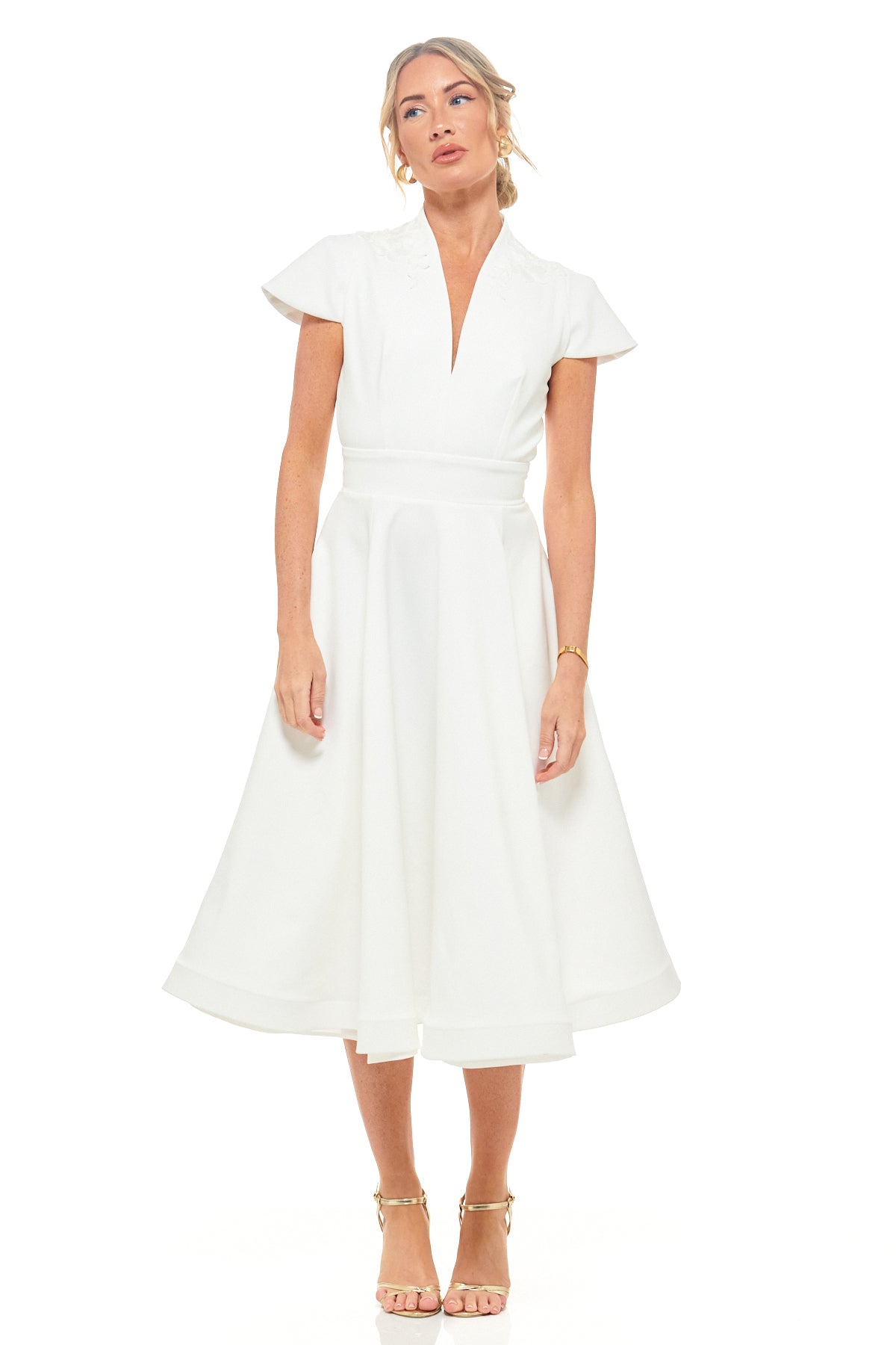 RHOEN ivory bridal midi dress featuring elegant cap sleeves, deep V-neckline, and a flattering A-line silhouette. A timeless designer piece perfect for wedding receptions, engagement parties, or bridal showers. Ex-Rebecca Rhoades design.