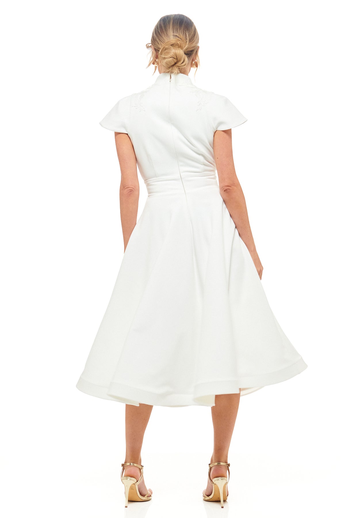 RHOEN ivory V-neck midi dress with structured bodice, subtle embroidery detail, and classic tea-length hemline. Luxury designer bridal fashion, previously known as Rebecca Rhoades.