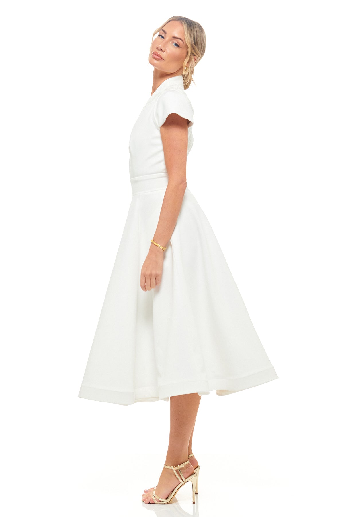 Designer ivory midi dress by RHOEN – feminine short sleeve bridal gown with deep V-neckline and A-line skirt, a chic choice for weddings, engagement events, and celebrations.