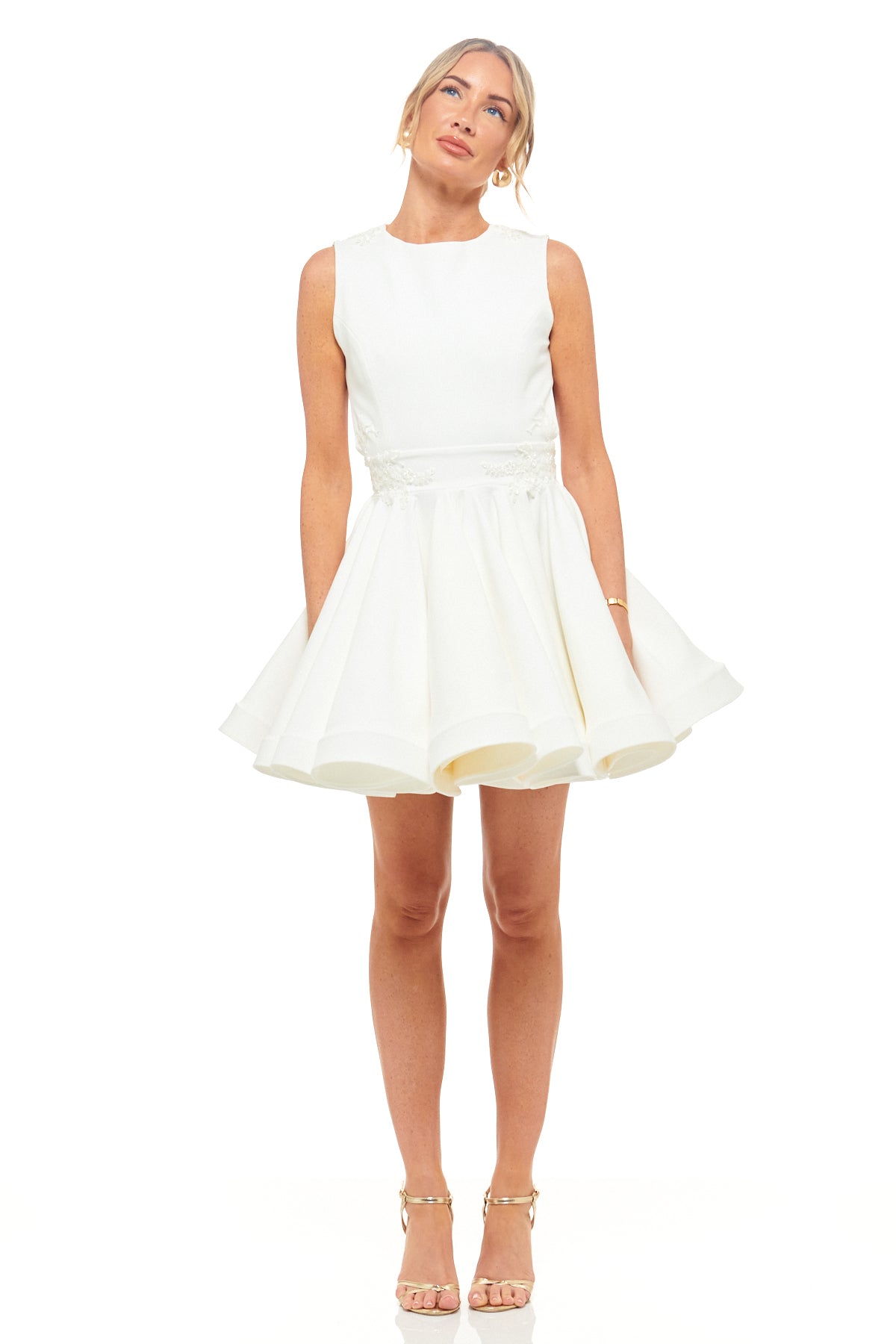 RHOEN ivory bridal mini dress with high neckline, open sides, bow back detail, and flared skirt – modern short wedding reception gown, ex-Rebecca Rhoades.