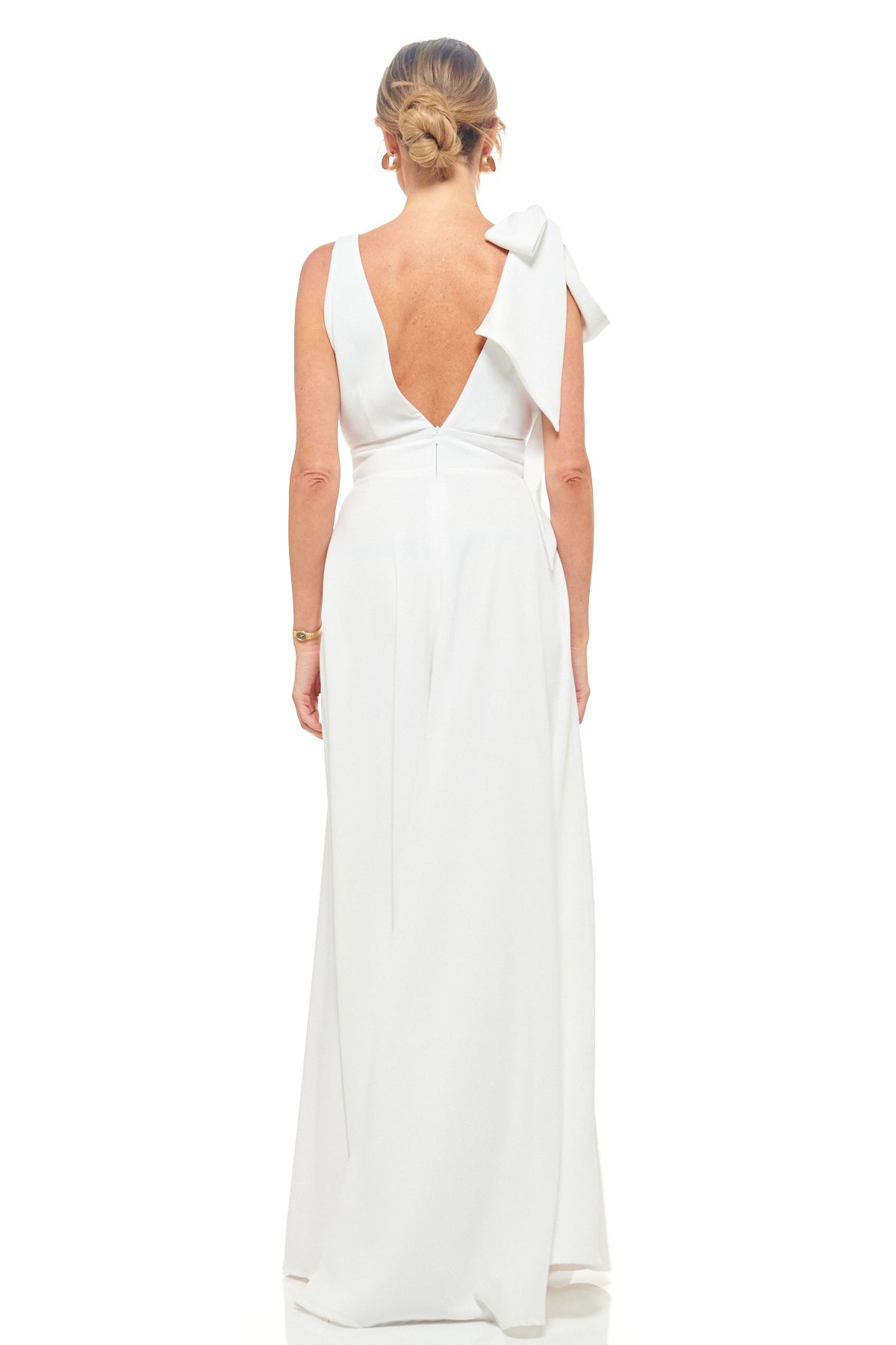 Designer ivory maxi dress by RHOEN – sophisticated bridal-inspired gown with statement shoulder bow and flattering V-neckline.