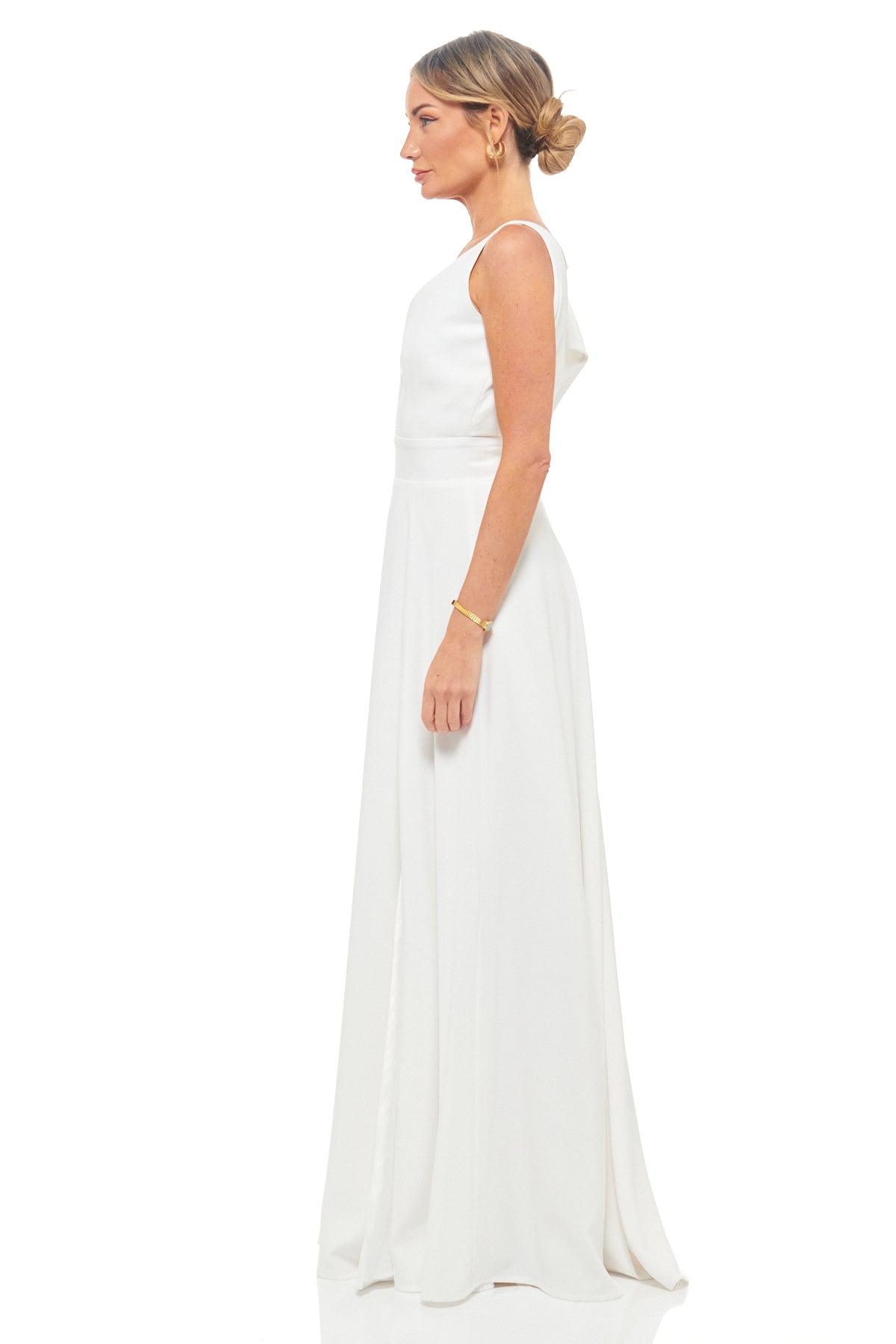 RHOEN ivory evening gown – luxury satin maxi dress with dramatic bow detail on one shoulder and timeless A-line silhouette.