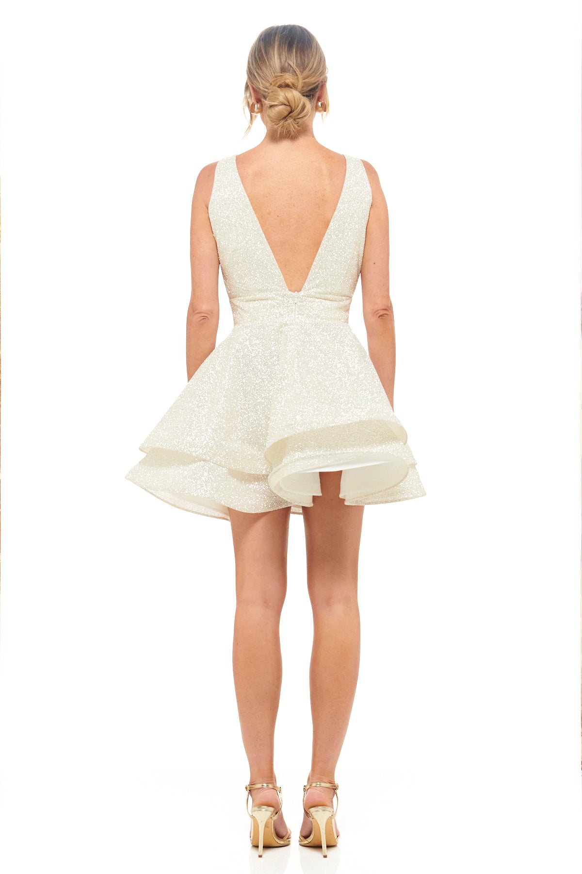 RHOEN sparkle-effect ivory mini dress with a plunging V-neckline, fitted bodice, and tiered flared skirt – chic cocktail or after-party bridal look.