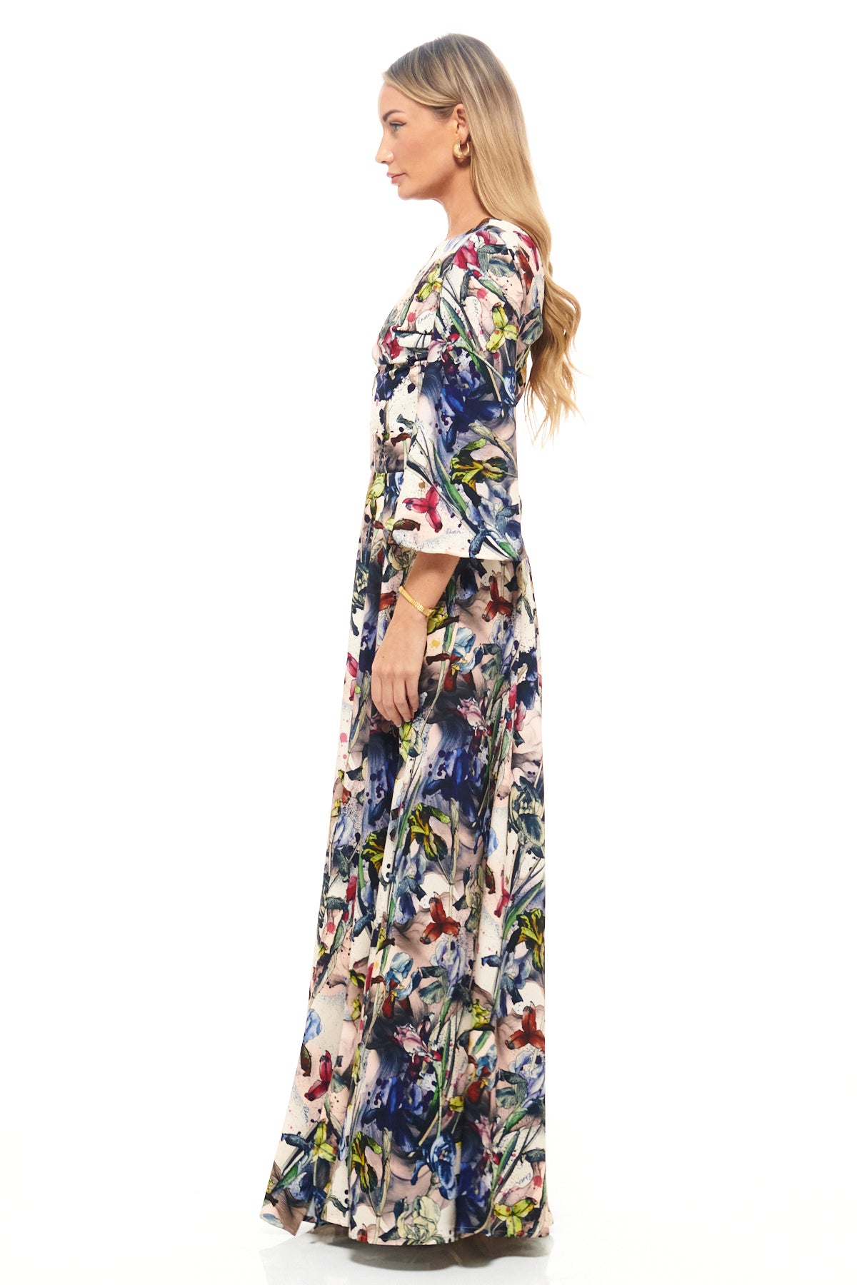 RHOEN full-length bespoke print dress featuring exclusive Rebecca Rhoades design, long flared sleeves, and elegant side slit for modern occasionwear.