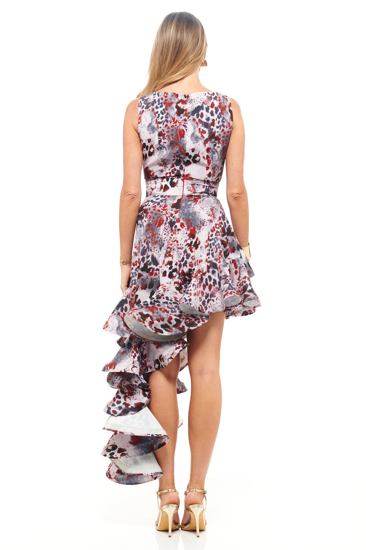 RHOEN bespoke print cocktail dress – striking asymmetric hemline with tiered ruffles, bold animal-inspired pattern, and elegant fitted bodice.