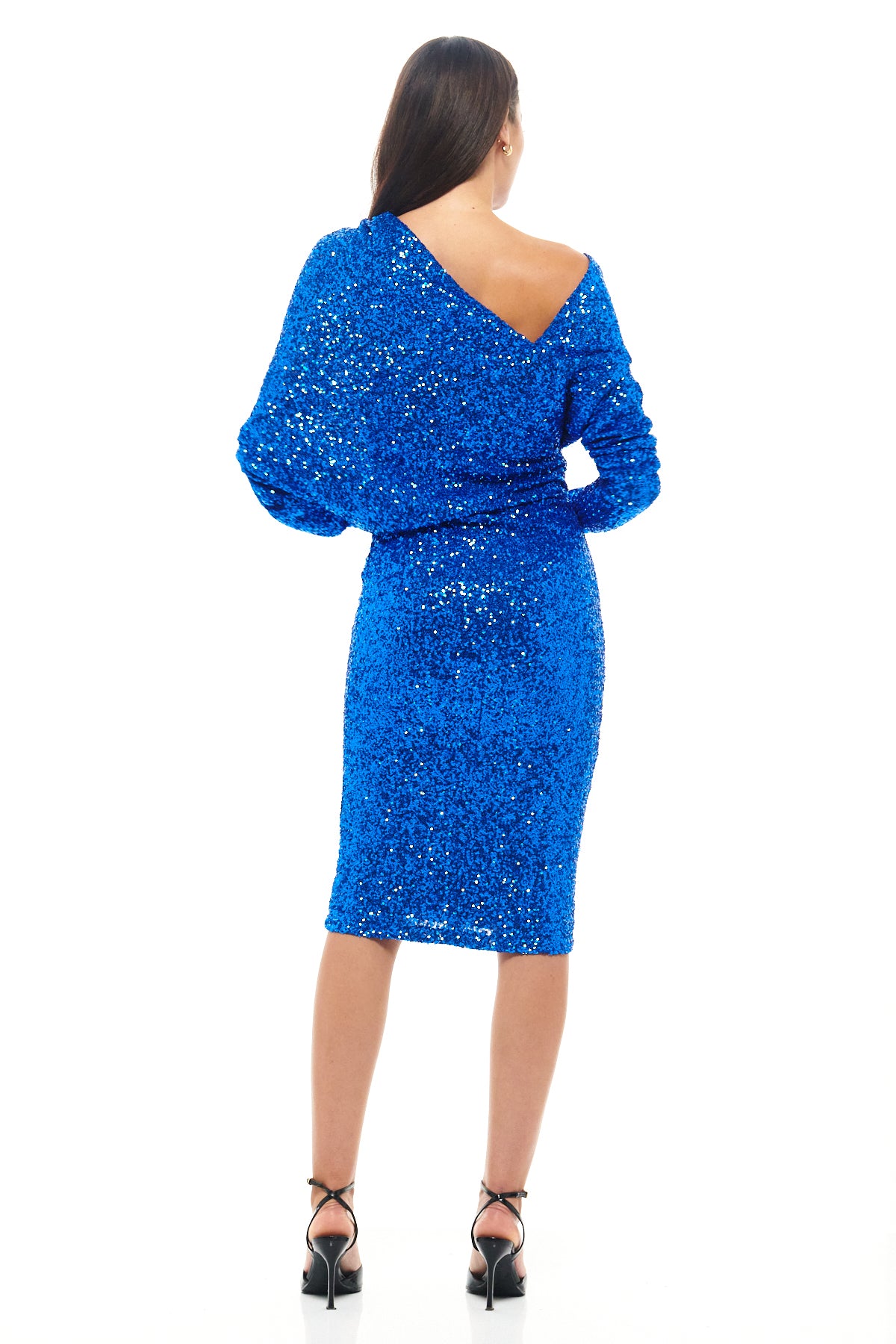 Striking blue sequin cocktail dress by Rhoen, with a chic off-shoulder effect, long sleeves and pencil skirt silhouette. A dazzling evolution of Rebecca Rhoades’ sequin classics.