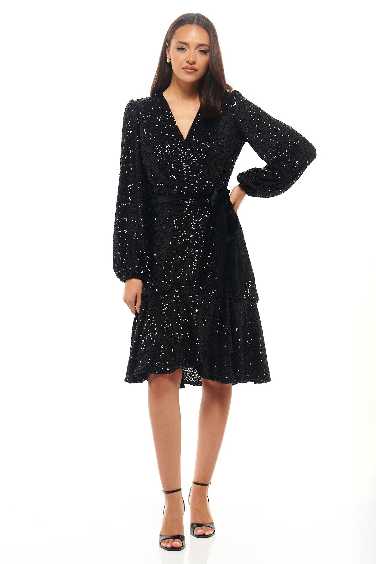 Sophisticated black sequin midi dress by Rhoen, featuring a wrap silhouette, full-length sleeves and tie belt detail for a flattering fit and timeless sparkle.