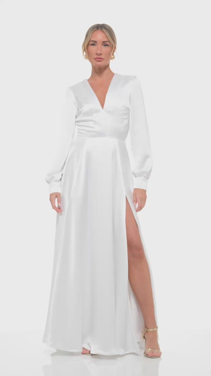 Luxury bridal fashion video by Rhoen – full-length satin gown with long sleeves and plunging neckline, ex-Rebecca Rhoades design.