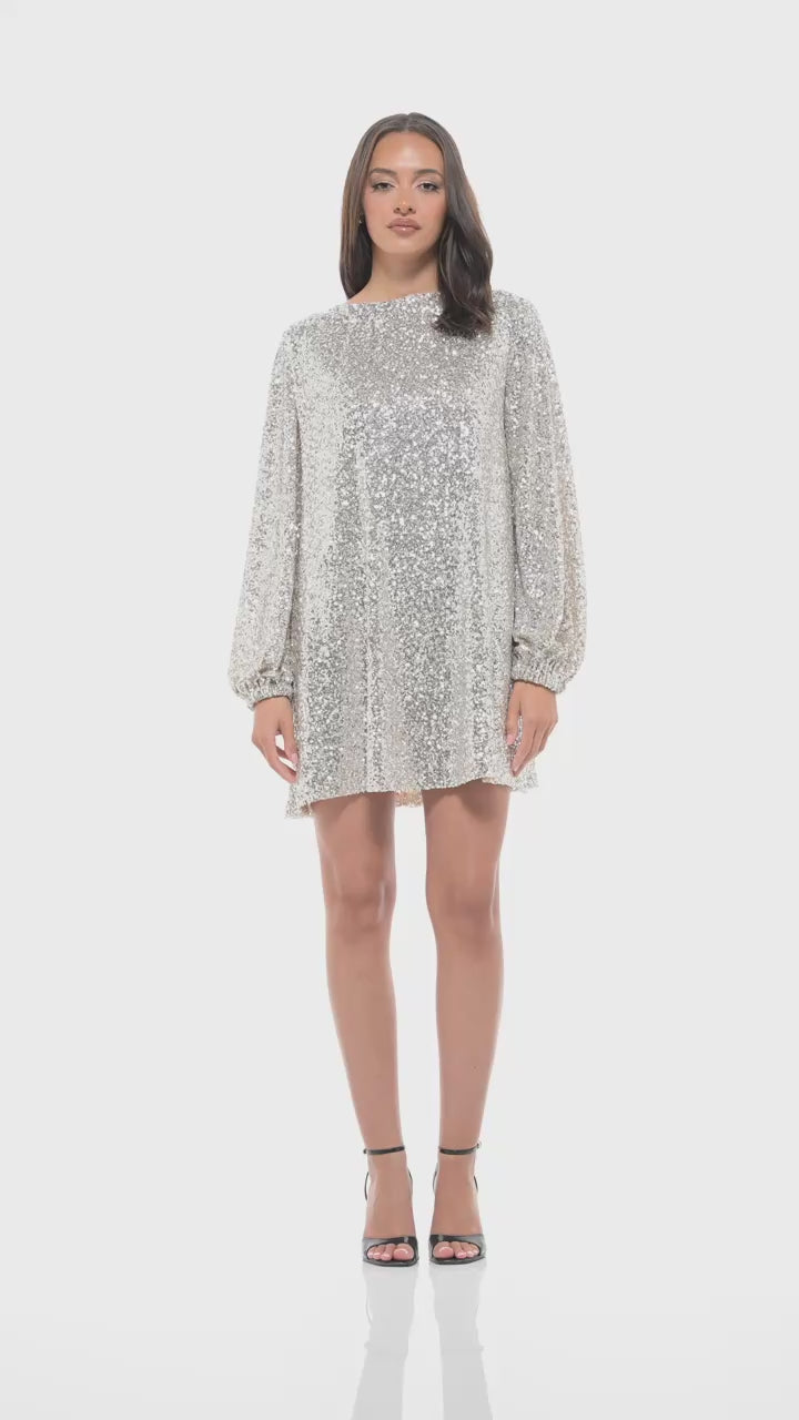 Rhoen designer sequin mini dress in light silver, crafted for glamour and comfort. Features soft long sleeves, mini cut, and radiant sequins designed to sparkle at every event.