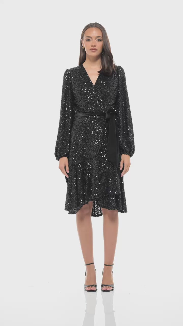 Timeless black sequin midi by Rhoen with feminine wrap cut, waist tie and glimmering all-over sequins, the perfect piece for statement evenings.