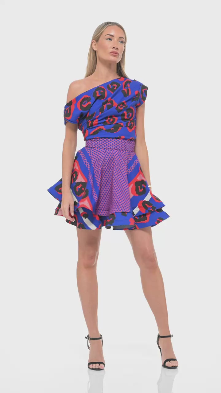 RHOEN bespoke blue and red leopard print mini dress – luxury one-shoulder skater-style gown with ruched bodice and flared hem, exclusive Rebecca Rhoades design.