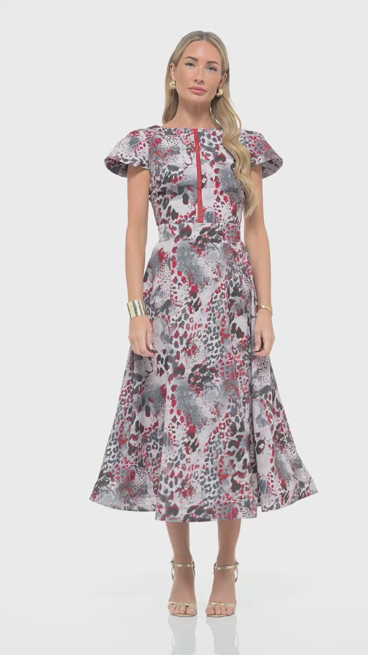 Statement midi dress by RHOEN – bespoke red, grey, and black animal print design with flared skirt and elegant waist tailoring.