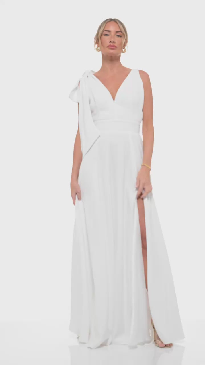 Ivory satin maxi dress – RHOEN (formerly Rebecca Rhoades) designer gown featuring deep V-neck, bow shoulder detail, and elegant draping.