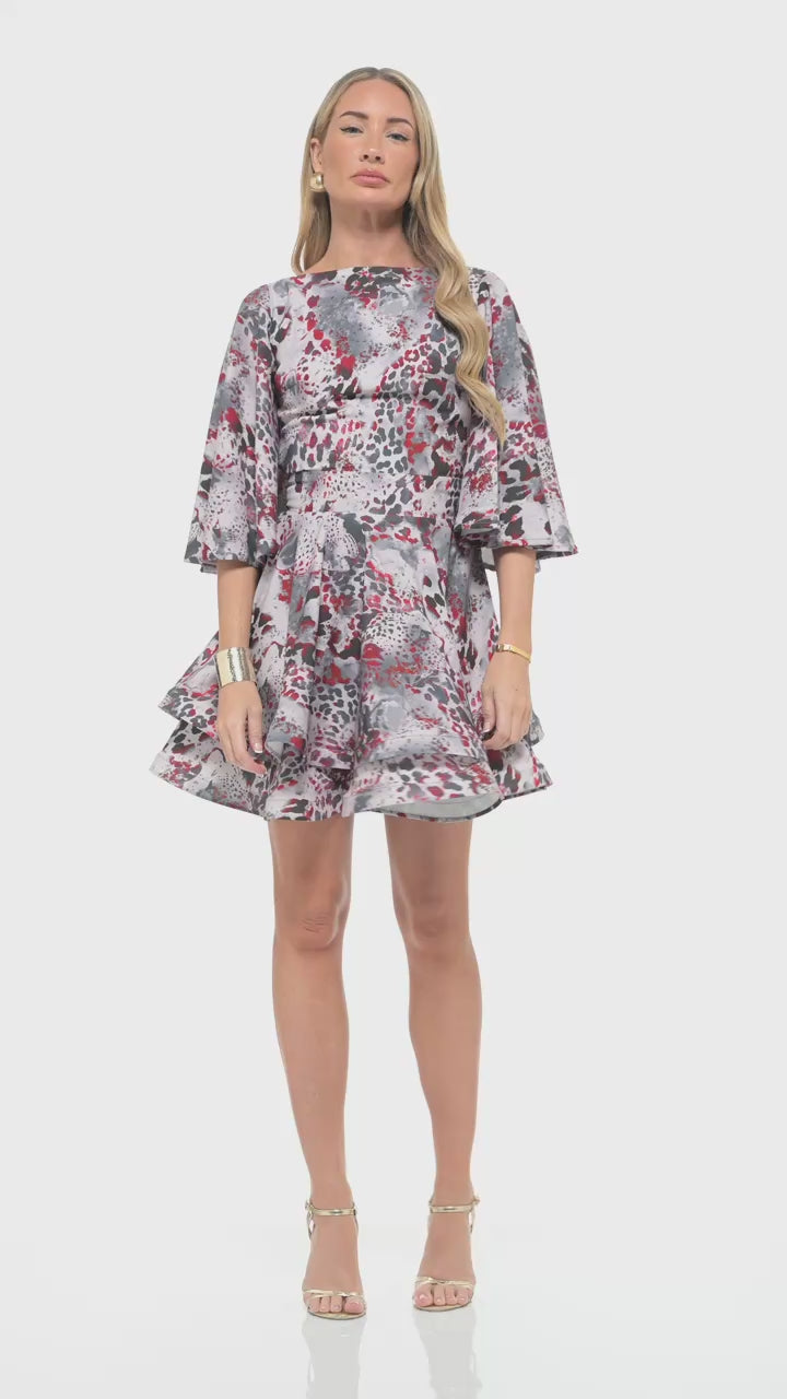 RHOEN red and grey animal print mini dress – luxury designer piece with wide three-quarter sleeves, tailored waist, and tiered ruffle hemline. Created by Rebecca Rhoades.