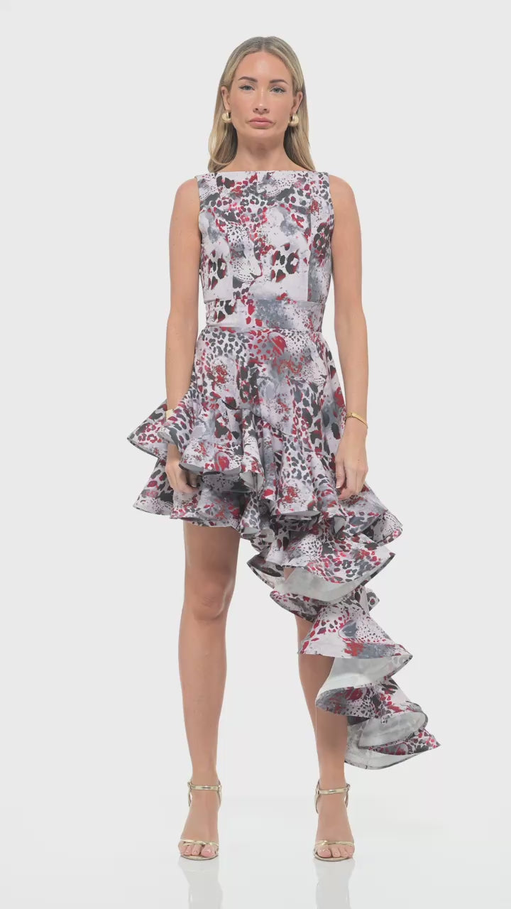 RHOEN statement animal print dress – luxury Rebecca Rhoades design with bold sleeveless silhouette, cinched waist, and dramatic cascading ruffle skirt.