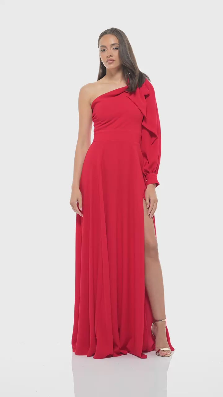 Rhoen red evening gown with asymmetric neckline and statement puff sleeve, finished with a floor-sweeping skirt and daring side slit.