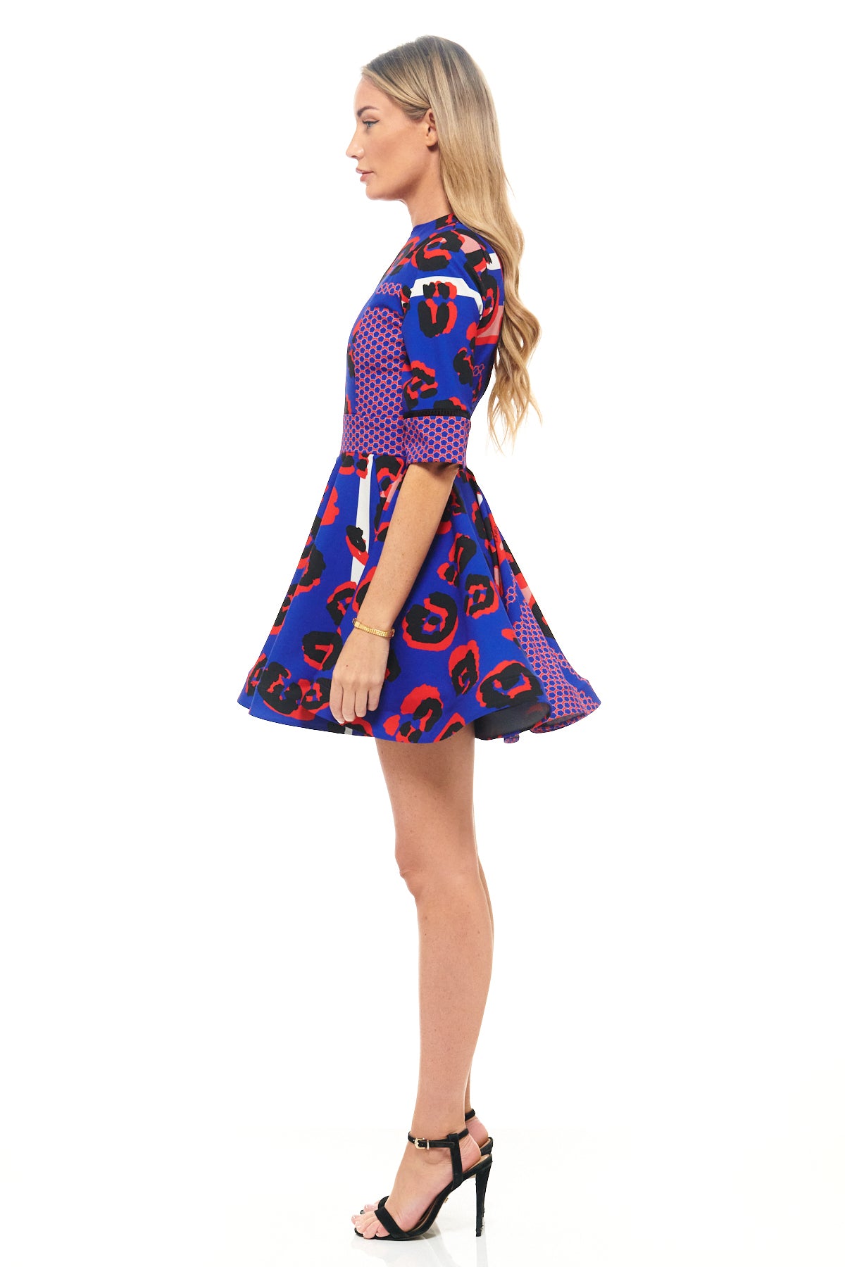 Designer mini dress by RHOEN in striking blue leopard print with graphic red detailing, structured bodice, and playful A-line silhouette.