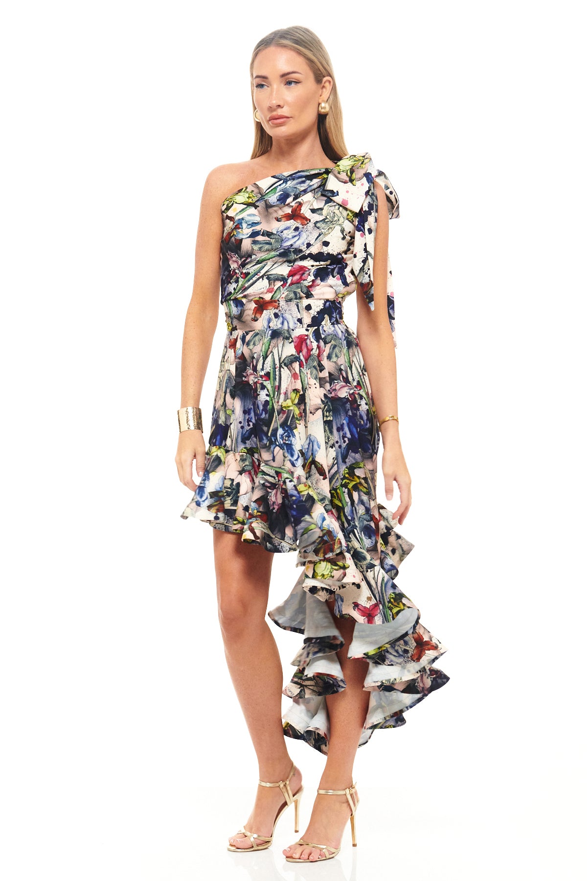 Luxury occasion dress by RHOEN – bespoke floral artwork with one-shoulder neckline, ruched bodice, and high-low ruffled hem for a statement silhouette.