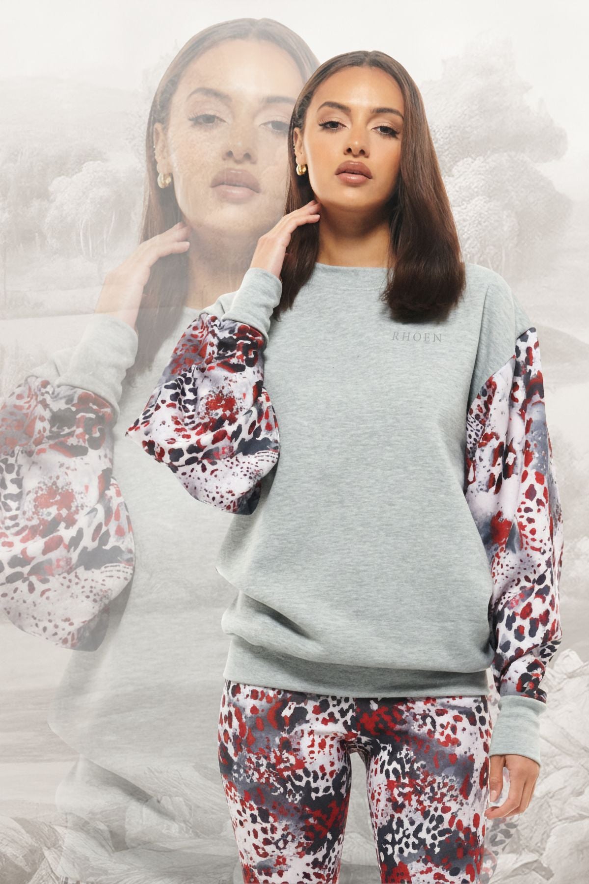 Rhoen grey sweatshirt with exclusive balloon sleeves in abstract red, black, and white print, styled with matching leggings.