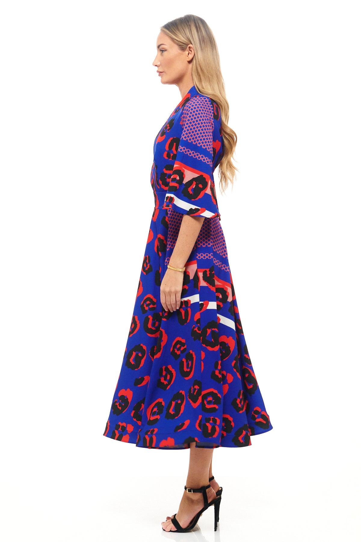 Designer midi dress by RHOEN in striking blue and red leopard print, featuring three-quarter sleeves, fitted waist, and flowing skirt