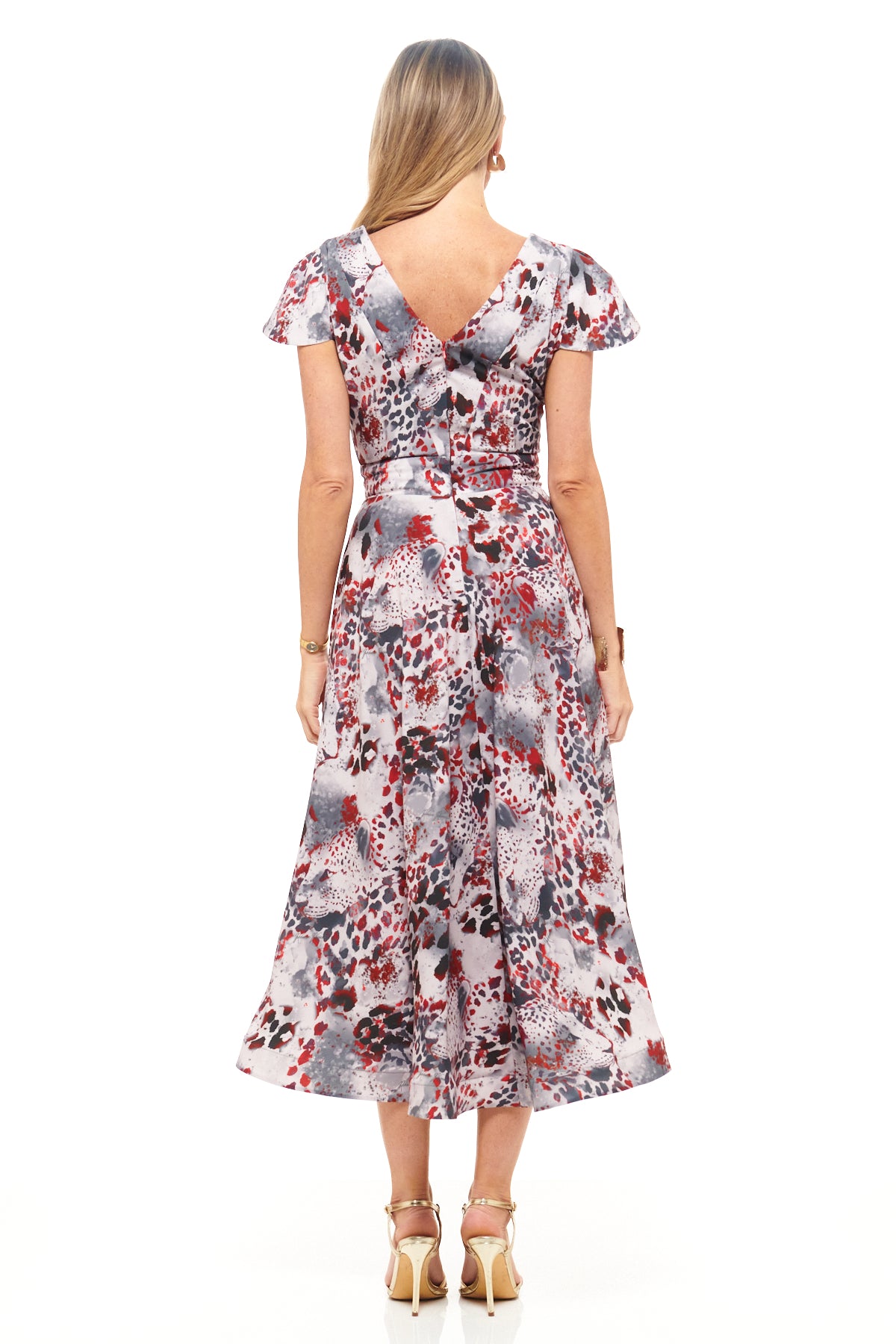 Designer midi dress by RHOEN in bold animal-inspired print, featuring short flutter sleeves, structured bodice, and elegant mid-length skirt.