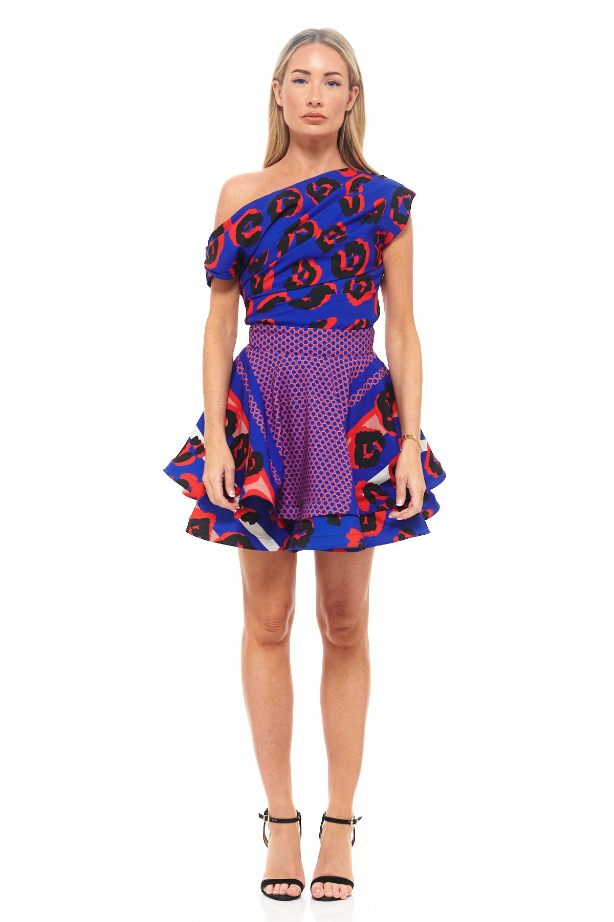 RHOEN blue leopard print mini dress with one-shoulder neckline, ruched bodice, and flared skirt. Bold bespoke print designed by Rebecca Rhoades.
